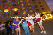 Alyssa Garcia-Sybert, a freshman from Omaha, smiles as she dances with friends at the Harper Schramm