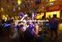 Lydia Hernandez, a freshman from Omaha, smiles as she dances with her friends at the Harper Schramm 