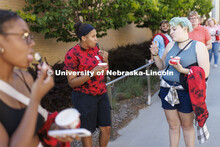 Brannon Evans, a senior from Omaha, left, talks with Rain Sidwell, a freshman from Boulder, Colorado