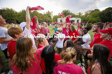 A group of students dance at the Chancellor’s BBQ to welcome the class of 2026 in the greenspace b