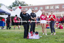 UNL Police Department officers play cornhole at the Chancellor’s BBQ to welcome the class of 2026 