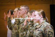 ROTC cadet Kolby Daily recites the oath given by Lt. Col. Mark Peer at the contracting ceremony. The