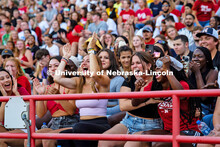 UNL students cheering as they catch a t-shirt at the Boneyard Bash in Memorial Stadium. August 20, 2