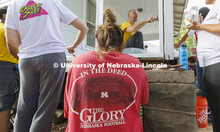 First-year law students, faculty, staff and family members come together to paint a house at 518 S. 