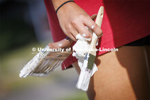 First-year law students, faculty, staff and family members come together to paint a house at 518 S. 