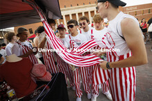 Students on Smith Residence Hall’s tenth floor admire the striped overalls they all wore to the St