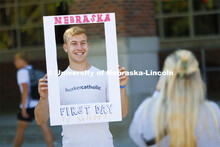 Gabe Sehnert, a sophomore from McCook, Nebraska, has his photo taken holding a picture frame. Husker