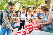 Students enjoy some Dairy Store ice cream at the College of Architecture Ice Cream Social outside of