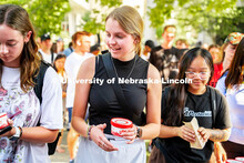 Students enjoy some Dairy Store ice cream at the College of Architecture Ice Cream Social outside of