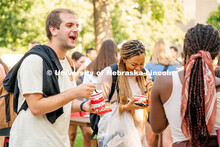 Students enjoy some Dairy Store ice cream at the College of Architecture Ice Cream Social outside of