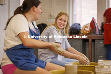 Sophie Hellebusch, right, a senior from Marthasville, Missouri, laughs with Kally Karkazis, a senior