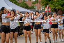 Members of Delta Phi Lambda Sorority Inc. outside the Union strolling during The Block Party. August