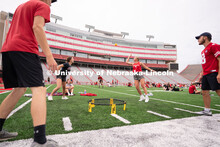 Husker fans play Spike Ball on the field at the Nebraska vs Northwestern football watch party in Mem