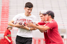 Husker fans play a game of football at the Nebraska vs Northwestern football watch party in Memorial