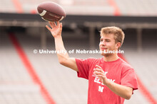 Husker fans play a game of football at the Nebraska vs Northwestern football watch party in Memorial