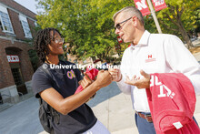 Chancellor Ronnie Green hands out Grit and Glory t-shirts at the Nebraska Union Plaza. September 7, 