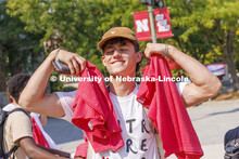 Peyton Vinckier, a freshman from Ashland, Nebraska, shows off his shirts he received. Chancellor Ron