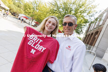 Cecan Porter, a junior from Omaha, poses with the Chancellor and her autographed shirt. Chancellor R