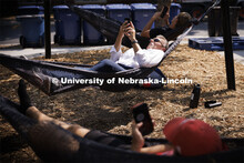 Chancellor Ronnie Green grabs a few minutes of calm in the hammocks at the Nebraska Union Plaza. Sep