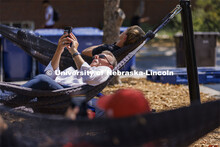 Chancellor Ronnie Green grabs a few minutes of calm in the hammocks at the Nebraska Union Plaza. Sep