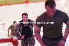 Midshipman Cohan Banow runs the east stadium steps. More than 160 UNL ROTC cadets along with active-