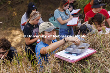 Kennadi Griffis places a sample into a tray for evaluation as she and fellow students in her NRES 27