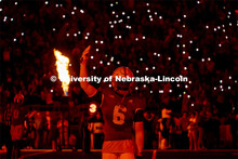 Nebraska football players work to defeat Georgia Southern. Nebraska vs. Georgia Southern football in