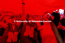 Cait Steiner, Kori Kowalewski and Emily Steiner cheer on the Huskers wearing corn costumes as the gi