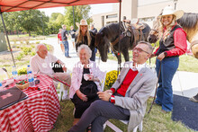 From left, Bill and Ruth Scott and Chancellor Ronnie Green pose with UNL Rodeo Club members Hallie R