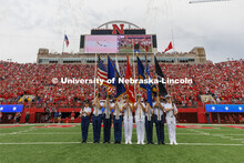 The ROTC Colorguard stand at attention on the field for the National Anthem. Nebraska vs Oklahoma Un