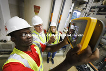 Bruce Dvorak, center, Professor of Civil and Environmental Engineering, coaches Yves Cedric Tamwo No