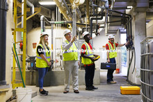 Bruce Dvorak, center, Professor of Civil and Environmental Engineering, discusses the equipment insi