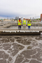 Bruce Dvorak, center, Professor of Civil and Environmental Engineering, discusses the sedimentation 