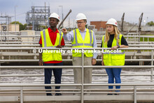 Bruce Dvorak, center, Professor of Civil and Environmental Engineering, discusses the sedimentation 