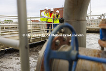Bruce Dvorak, left, Professor of Civil and Environmental Engineering, discusses the sedimentation ta