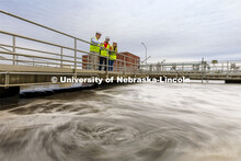 Bruce Dvorak, left, Professor of Civil and Environmental Engineering, discusses the sedimentation ta
