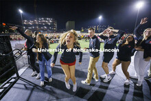 Aleksandra Glowik and other Homecoming Royalty react to cheering from their friends who were waiting