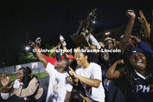 Members of the African People’s Union celebrate their RSO first place trophy on stage at Showtime 