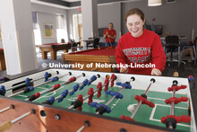 Students playing foosball. Housing Photo Shoot in Able Sandoz Residence Hall. September 27, 2022. 