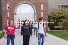 Students leaving The Courtyards Residence Hall to cross campus to classes. Housing Photo Shoot in Th