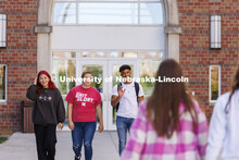 Students leaving The Courtyards Residence Hall to cross campus to classes. Housing Photo Shoot in Th
