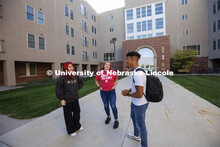 Students socialize outside the Courtyards Residence Hall. Housing Photo Shoot in The Courtyards Resi