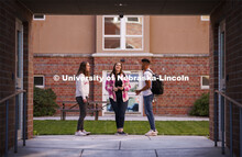 Students socialize outside the Courtyards Residence Hall. Housing Photo Shoot in The Courtyards Resi