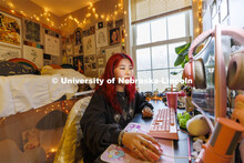 One student studying in their Courtyard Residence Hall room. Housing Photo Shoot in The Courtyards R