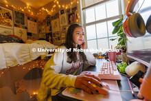 One student studying in their Courtyard Residence Hall room. Housing Photo Shoot in The Courtyards R
