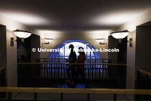 Two students stop to visit on a walkway in the Courtyards Residence Hall. Housing Photo Shoot in The
