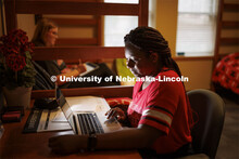 Students use their laptops to study in a University Suites Residence Hall room. Housing Photo Shoot 