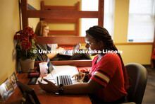 Students use their laptops to study in a University Suites Residence Hall room. Housing Photo Shoot 