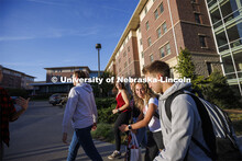 Students leaving University Suites Residence Hall to get to their classes. Housing Photo Shoot in Un