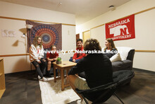Students socializing in a University Suites Residence Hall room. Housing Photo Shoot in University S